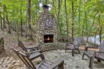 Custom Stone outdoor wood-burning fireplace
